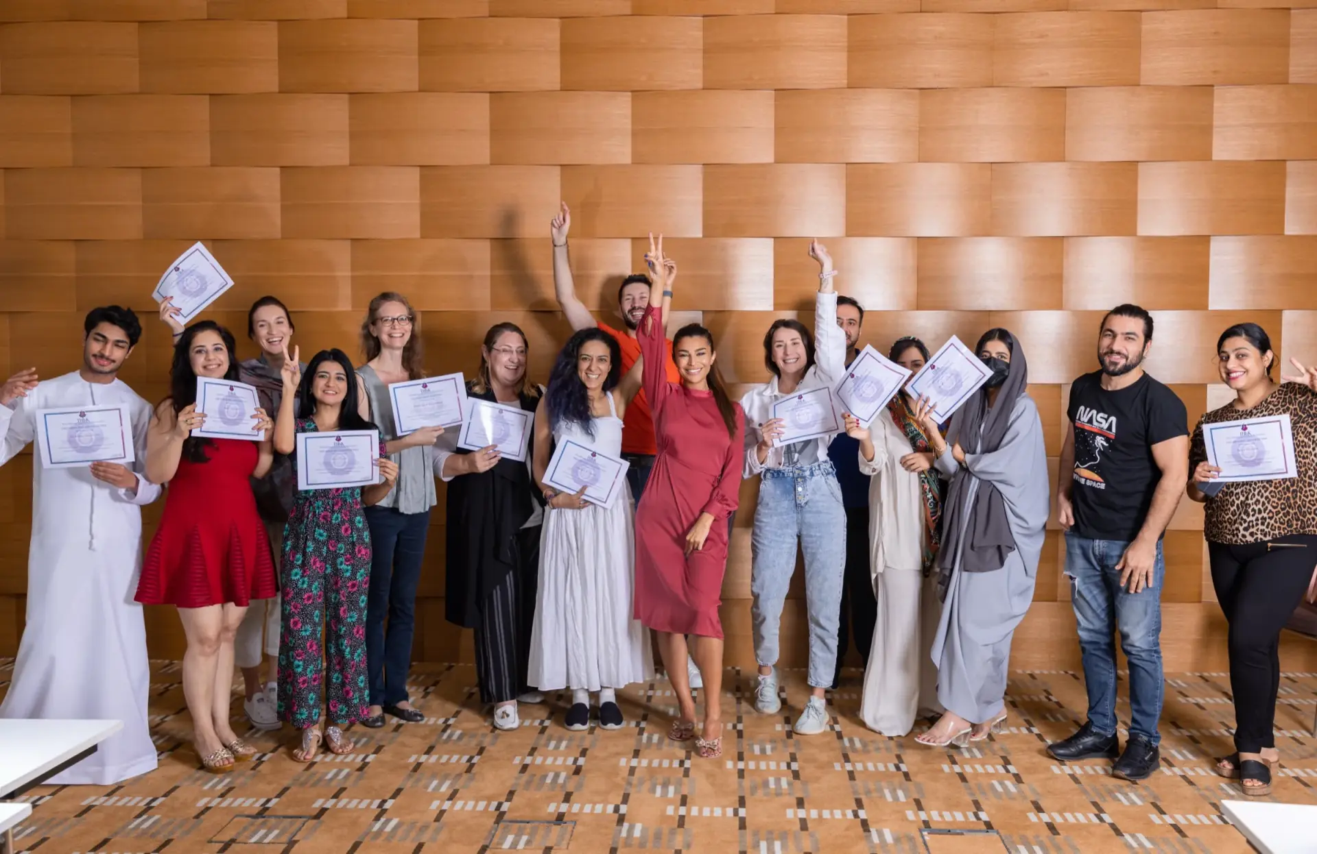 A full workshop group holding their certificates